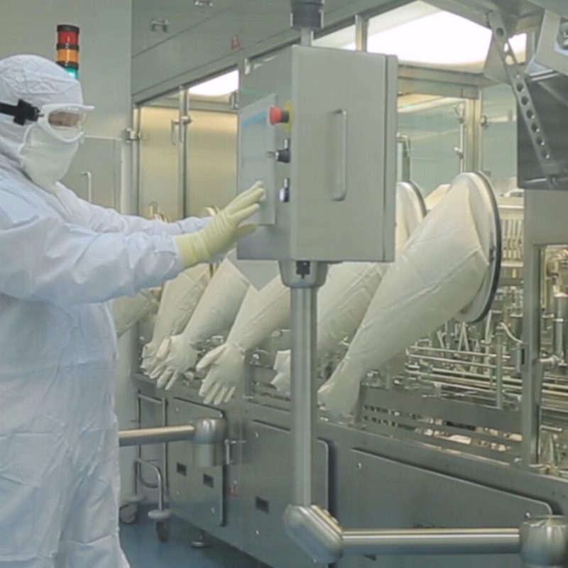 Pharmaceutical,Production,Line,Worker,At,Work.,Robotic,Arm,Lifting,Ampules